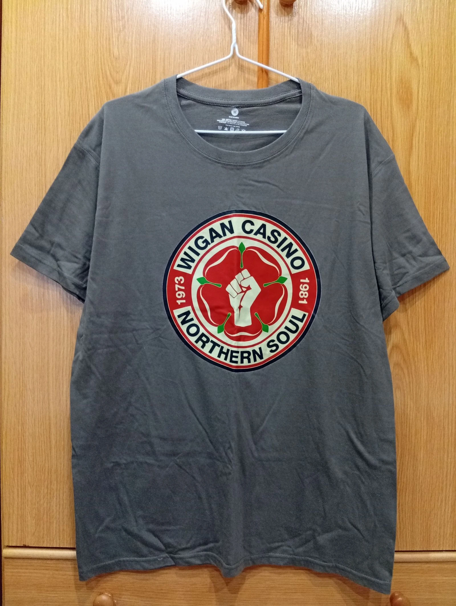 unisex size M T-shirt. Dark grey with a vintage-style "Wican Casino – Northern Soul" front graphic.